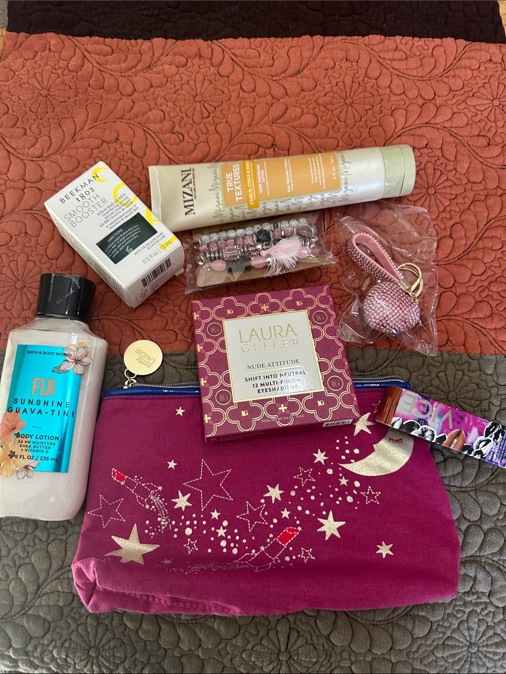 Laura Geller Nude Attitude Eyeshadow &  Estée Lauder bag filled with